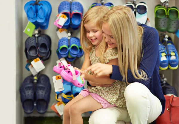 These will be perfect. a mother and daughter out shoe shopping in the mall