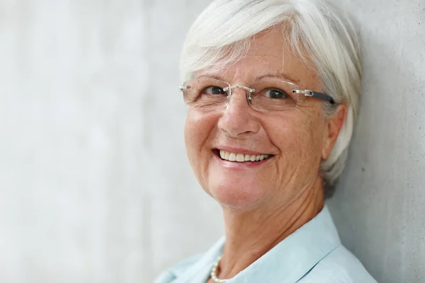 stock image Always act like youre wearing an invisible crown. Portrait of a senior woman smiling at the camera