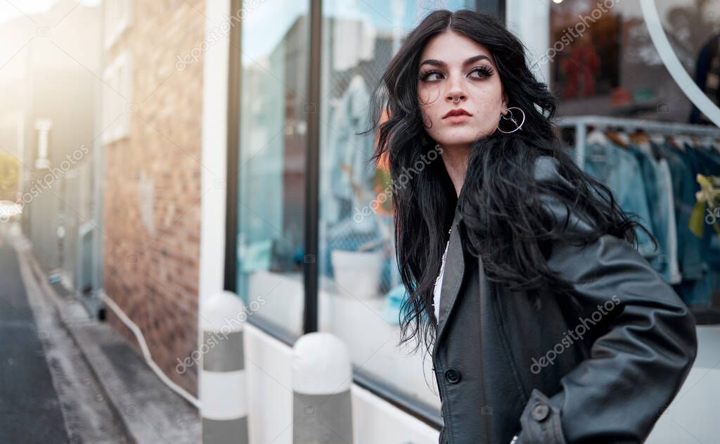 Urban fashion, style and a woman on the street at shop window, punk