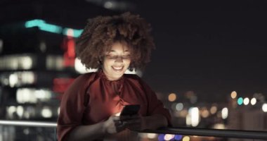 Night balcony, phone and woman typing social media app post, business email or contact social network user. New York city lights, dark rooftop and African girl reading blog, funny meme or mobile news.