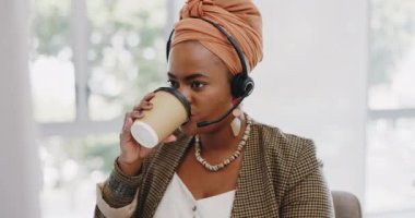 Call center, customer service and black woman consultant in the office consulting online while drinking coffee. Customer support, telemarketing and professional African female crm expert in workplace.