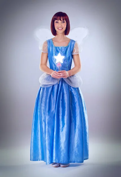 Ready to grant your wishes. A full length shot of a fairy godmother in a blue gown