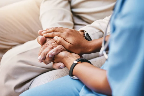 Nurse holding hands with patient in empathy, trust and support of help, advice and healthcare consulting. Kindness, counseling and medical therapy with doctor for hope, consultation and depression.