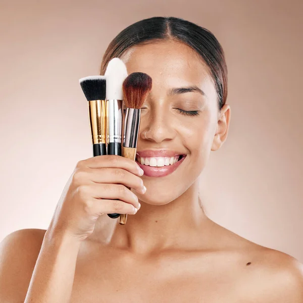 Makeup, tools and brush with face and woman, beauty cosmetics and wellness against studio background. Facial, treatment and cosmetic equipment, smile and microblading with skincare mockup.
