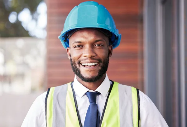 Portrait, engineer and black man with helmet, smile and construction planning. Architect, African American male or employee with idea for new building, safety hard hat and protection for architecture.