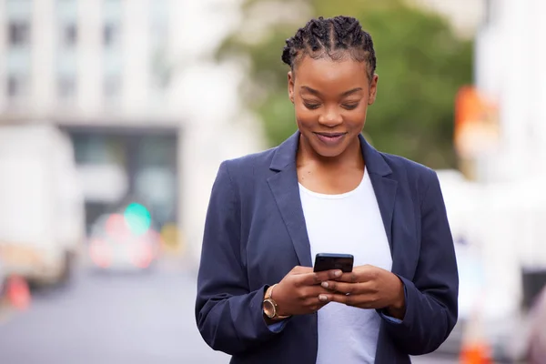 Black woman, phone and app communication on travel commute with online networking and social media check. Corporate worker on mobile internet break reading news with happy smile in urban town