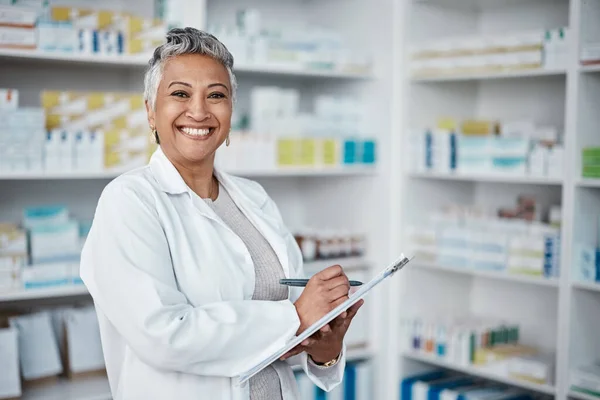 Pharmacy, woman and happy portrait with clipboard, checklist and inventory in Colombia. Happy pharmacist, manager and healthcare worker writing notes of professional retail, medical service and stock.