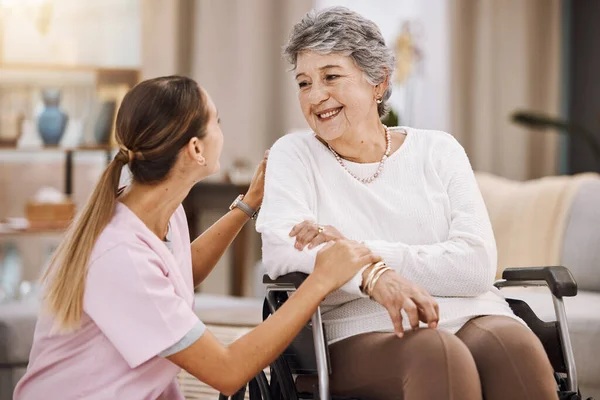 Wheelchair disability, rehabilitation and nurse volunteer at nursing home for charity work. Healthcare, support and caregiver with senior women for medical help, elderly care and consulting patient.