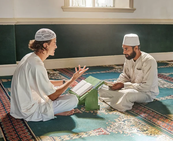 Muslim pray, worship or men studying the Quran for peace, mindfulness or support from Allah in holy mosque. Learning, Islamic or people talking, reading or praying to worship God on Ramadan Kareem.