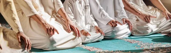 Islam, religion and prayer of a muslim man at mosque in ramadan for spiritual faith, God and belief while doing religious worship. Islamic or Arab culture people sitting to pray at holy place.