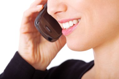 Shes deep in conversation. a young woman talking on a mobile phone