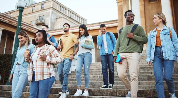 Students, diversity or walking on university steps, college campus or school stairs in morning class commute. Talking men, bonding women or education friends with learning goals in global scholarship.