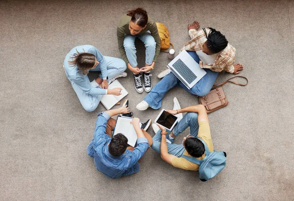 Study, laptop and group of students on floor in project, research or planning, brainstorming and teamwork. Notebook, education and top of university student, friends or people collaboration in school.