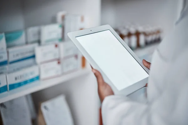 Pharmacy, doctor and tablet screen mockup for medicine checklist for medical healthcare, wellness store inventory and pharmacist dispensary. Clinic, employee hands and checking stock on digital tech.