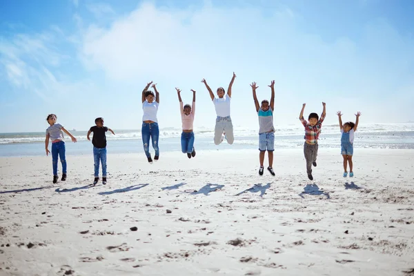 Big Family Beach Jump Adventure Holiday Sky Bonding Interracial Diversity — Stock Photo, Image