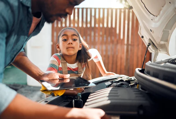 Car problem, tablet and diagnostic software with man and child learning about mechanic repair for family vehicle. Father and daughter or girl bonding while working on engine together using mobile app.