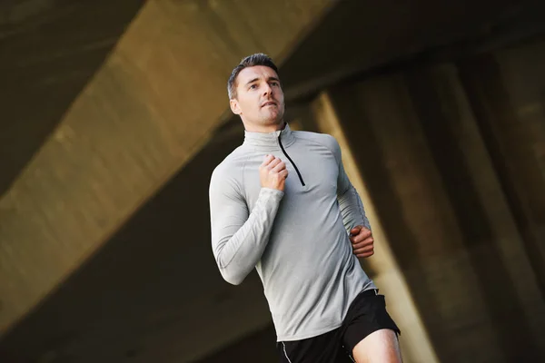 Training Best Young Man Taking Brisk Run Outdoors — Stockfoto