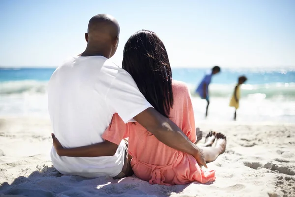 Enjoying Life Affectionate African American Couple Hugging Watching Children Play — Stockfoto