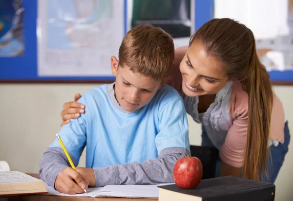 Helping Him Write His Own Future Supportive Young Teacher Leaning —  Fotos de Stock