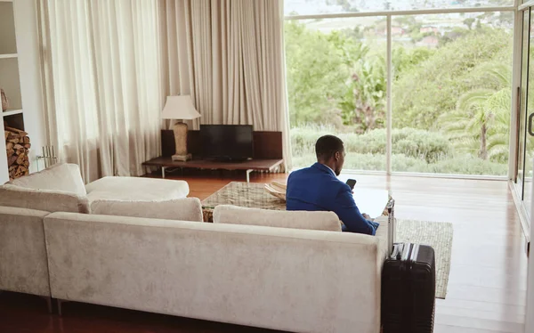 Phone Travel Hospitality Business Black Man Sitting Sofa Living Room —  Fotos de Stock