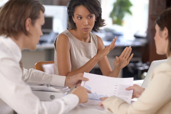 Hold on a second - Lets discuss that idea a little. Attractive businesswoman debating with her coworkers