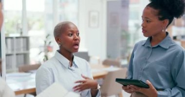 Business, black woman and talking with team, staff and explain schedule, planning logistics and brainstorming, African American female employee, leader and group share ideas, discussion and teamwork.