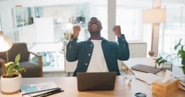 African businessman, fist celebration and laptop working in office for planning success, happiness and online winner. Black man, yes and excited, celebrate corporate achievement or happy promotion.