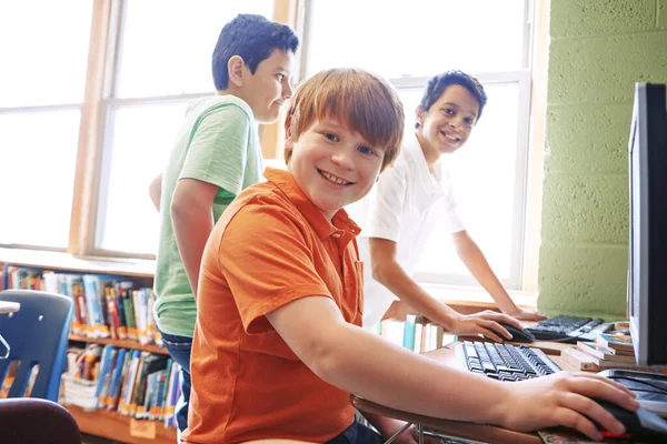 Children, education or portrait in classroom on computer for learning, research or website search. Scholarship, thinking or happy students in school library for social network, academy or assessment.