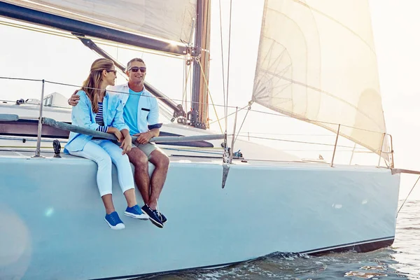Couple, boat cruise and yacht while sailing for romantic date on sea for summer holiday or vacation. Man and woman on ocean for luxury adventure in cruise ship together to relax with love and travel.