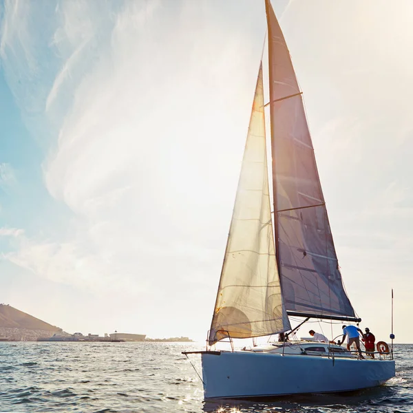 Ocean, yacht travel and sailing on the sea on vacation by summer sunshine on water. Lens flare, luxury holiday adventure and boat cruise of people in the sun and blue sky in nature with mockup.