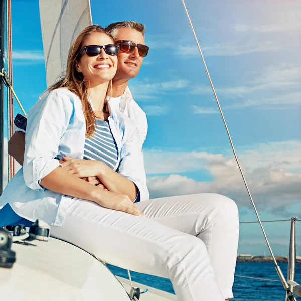 Relax, travel and luxury with couple on yacht for summer, love and sunset on Rome vacation trip. Adventure, journey and vip with man hug woman sailing on boat for ocean, tropical and honeymoon at sea.