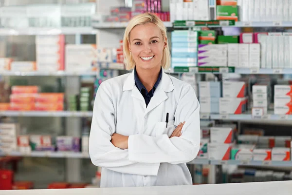 Doctor, pharmacy worker and happy portrait ready for medical support, wellness industry and standing pharmaceutical drug store. Woman, nurse smile and healthcare medicine or pharmacist headshot.