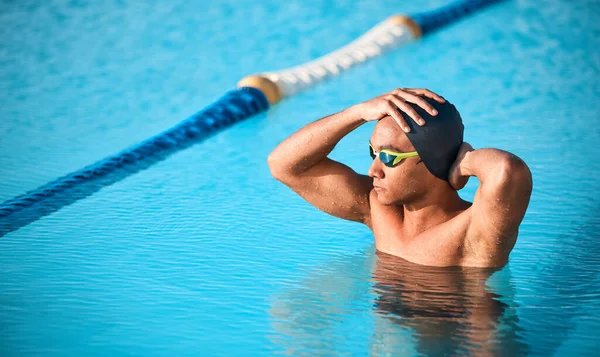 Hes got swimming on his mind. a handsome young male athlete swimming in an olympic-sized pool