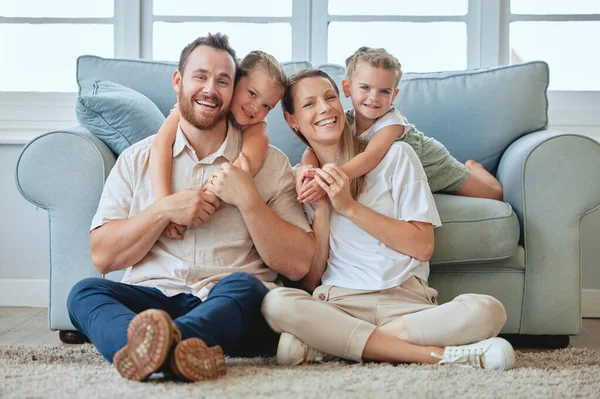 keep-a-smile-on-your-face-a-young-family-relaxing-at-home-stock