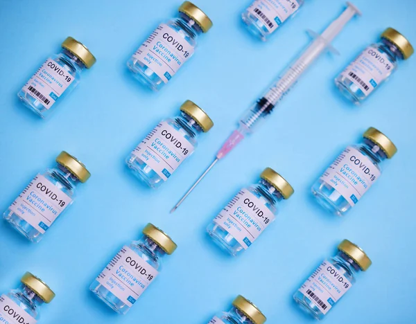 You can get it if you want it. vaccines and a syringe against a blue background