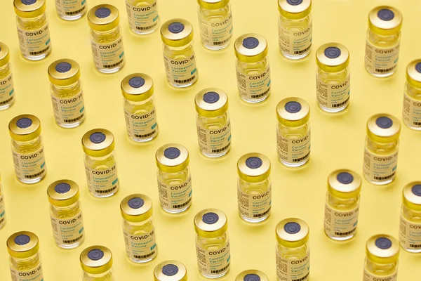It could save your life. Studio shot of vaccine tubes against a yellow background
