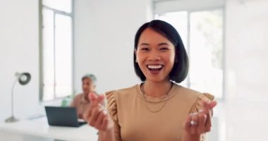 Happy, goofy and face of a business woman in the office with a love, peace and heart hand gesture. Happiness, fun and portrait of a professional female employee from Asia with signs in the workplace