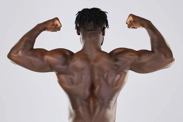 Black Man Fitness Flex Muscle Sports Training Studio Strong Body Stock  Photo by ©PeopleImages.com 635845784