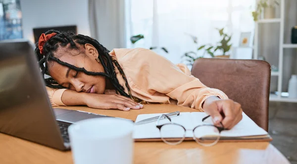Black woman, sleeping and studying in home office with a book while learning online with fatigue. Entrepreneur person tired, burnout and exhausted with remote work and startup business stress.