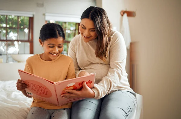 Pregnant mother reading to kid for fun learning, language and home development help, support and bonding. Family, Indian people or mom and child, storytelling book for creative education or teaching.