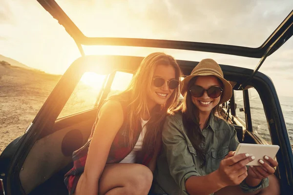 Women friends, selfie and car on vacation, beach and sunset on social media app with smile by waves. Woman, smartphone and outdoor in suv, ocean holiday or road trip for summer sunshine on internet.