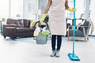 Do it daily for a dirt free home. an unrecognisable woman mopping the floor at home