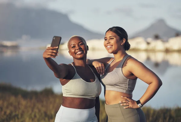 Few things look better than that post-workout selfie. two women taking a selfie while out for a run.together