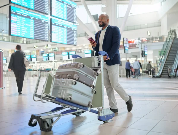 Airport, black man and luggage for travel, smile and business convention with ceo, walking and tourism. African male entrepreneur, corporate leader and employee with suitcases, happiness and commute.