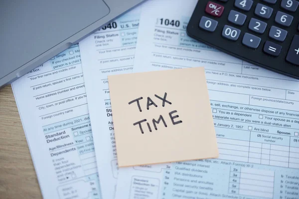 Tax time, accounting paperwork and form for government law compliance, file income revenue return or self assessment. Calculator, sticky note and finance audit form for financial payment and taxes.