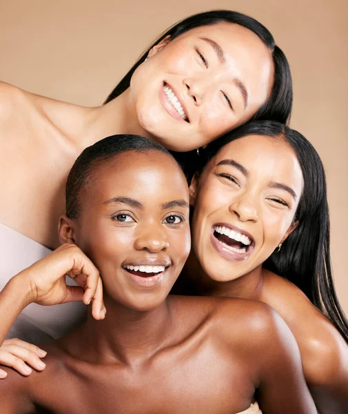 Friends, diversity and skincare, women smile together in happy portrait on studio background. Health, wellness and luxury cosmetics for skin care and beautiful multicultural people in natural makeup