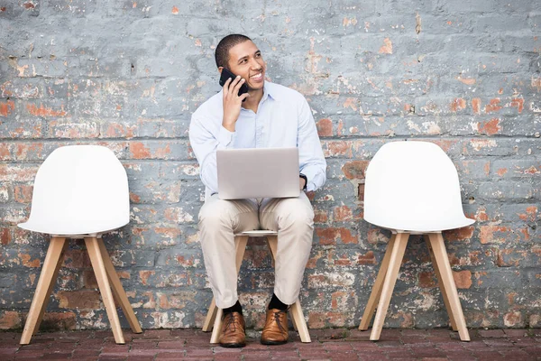 Recruitment, phone call and black man thinking on brick wall or waiting room for career dream, opportunity or job search. Happy person in line on smartphone for hiring news, interview and recruiting.