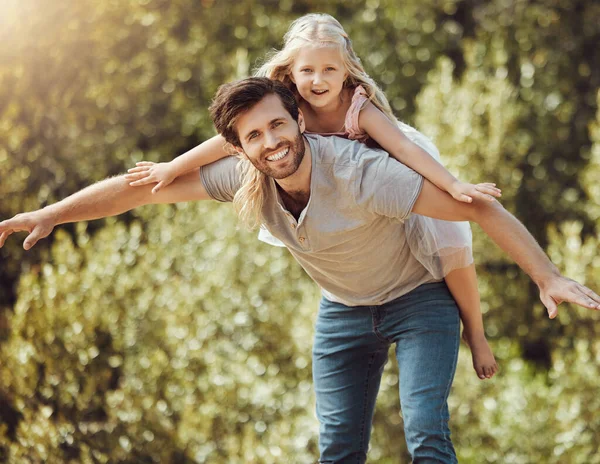 Family, portrait or piggy back in airplane game, nature park or home garden and house backyard, trust or support. Smile, happy or father carrying child in flying fun, energy or summer bonding freedom.