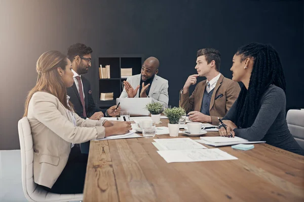 Lets take this to the next level. a group of Shot of a group of young businesspeople having a meeting in a modern office having meeting at work