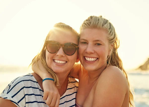Never let your best friend go to the beach alone. young female best friends hanging out at the beach